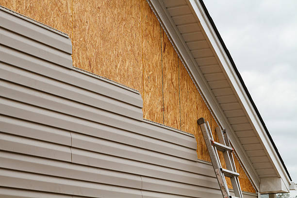 Professional Emergency Siding Repair technician working in Transfer, PA
